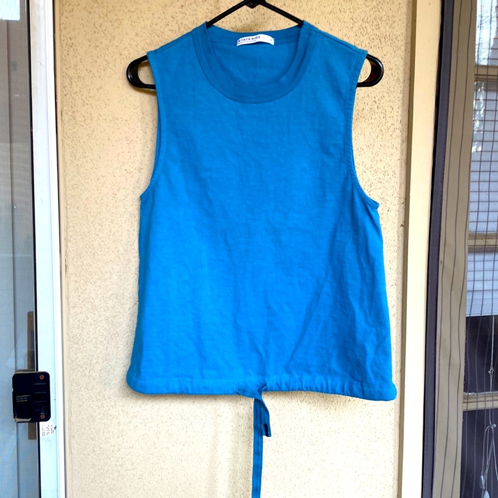 Sleeveless teal fitted top .   Brand new !   No tags , sintched at waist